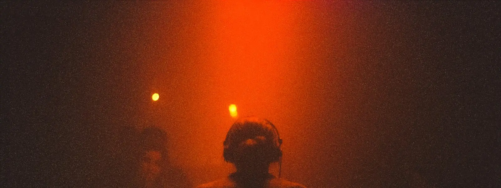 A DJ standing at the decks