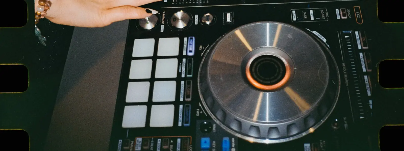 A DJ mid-set behind the decks