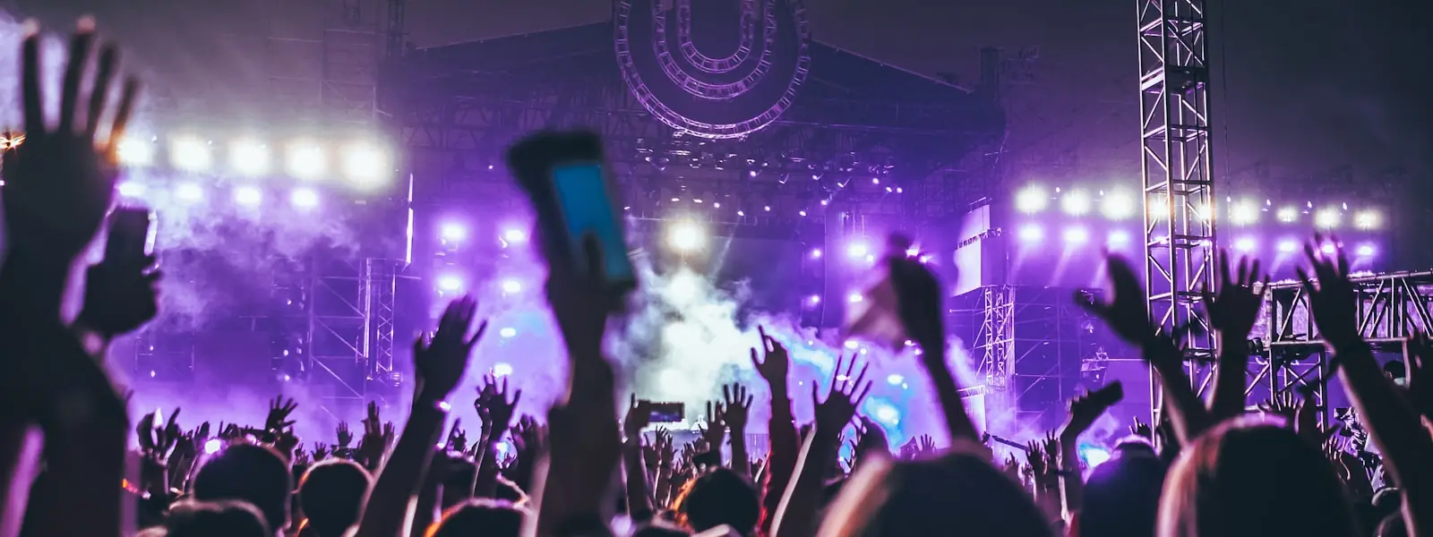 A crowd with raised hands